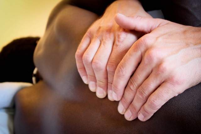 Hands on back